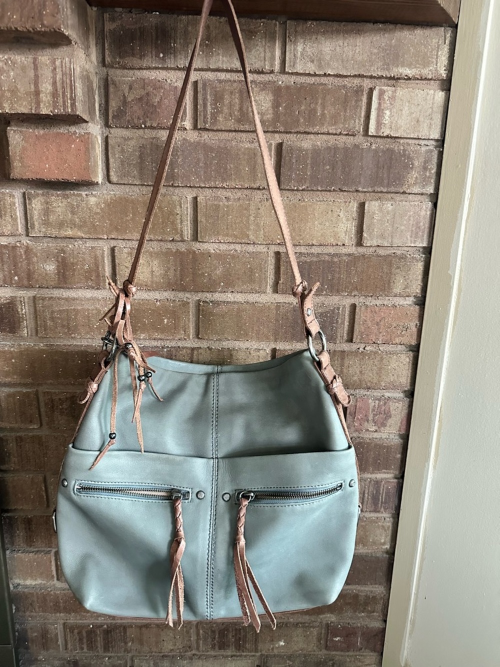 The Sak Gray Leather Multi-Pocket Hobo Shoulder Bag with Fringe Tassels